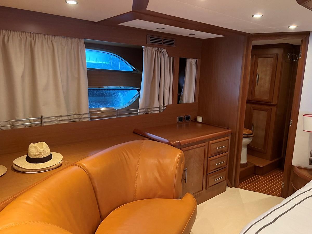 a room with a desk and a window aboard B Yacht for Sale