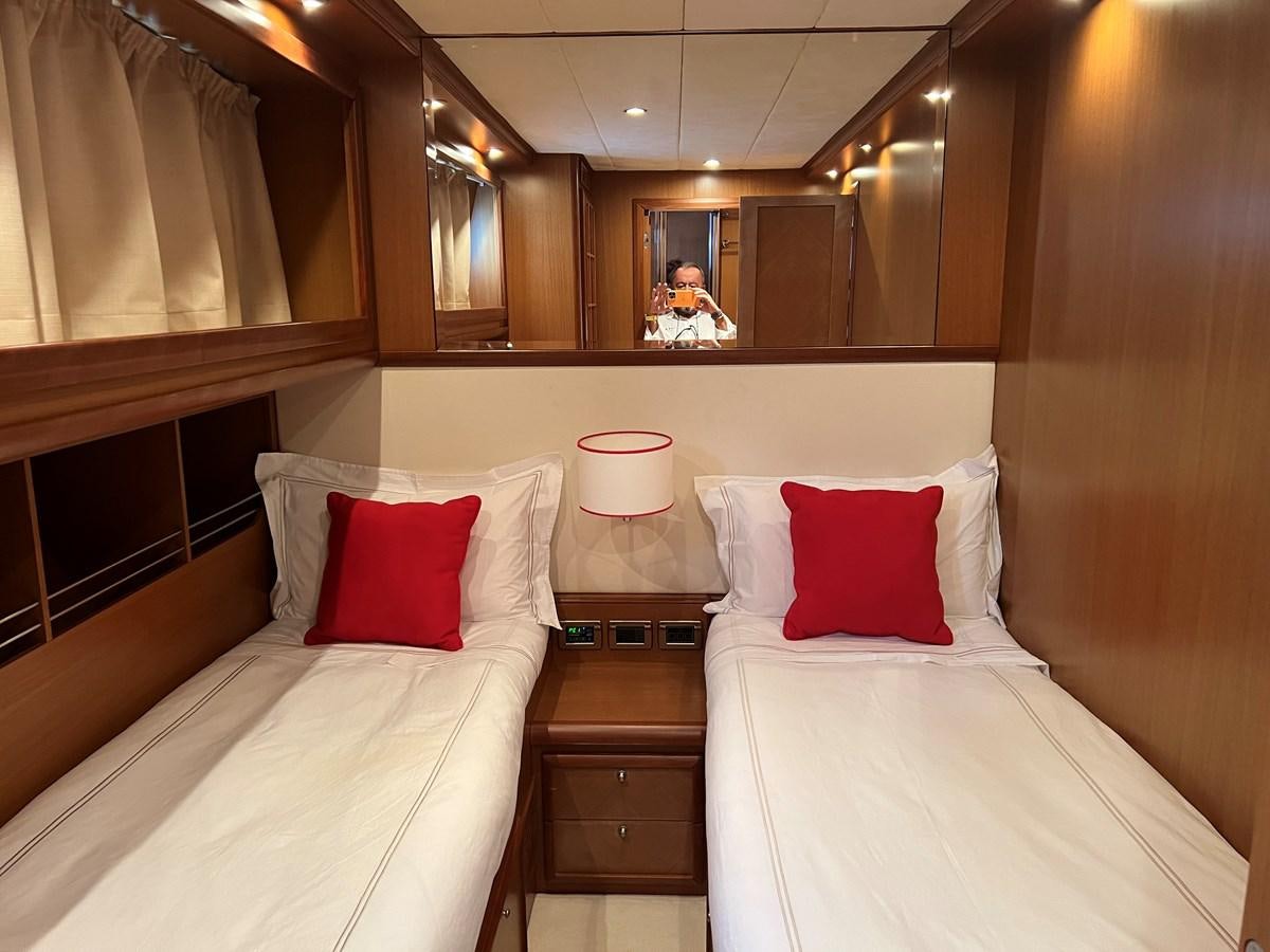 a couple of beds in a hotel room aboard B Yacht for Sale