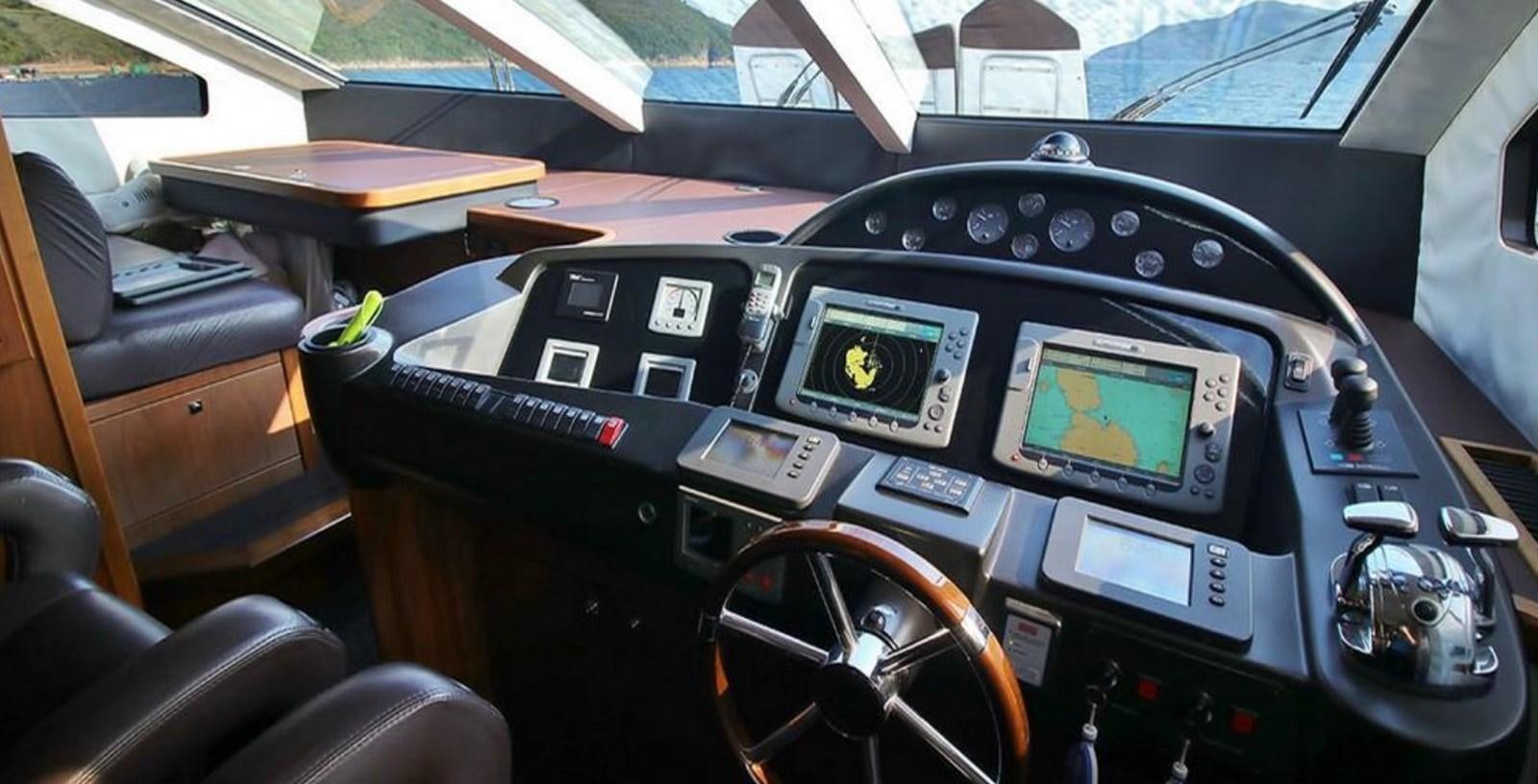 inside of a car aboard AEGII Yacht for Sale