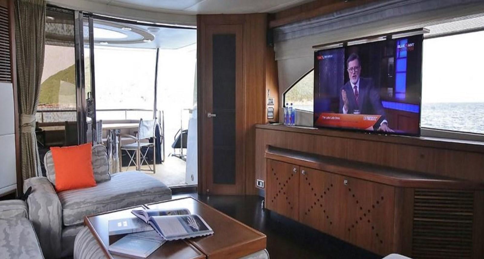 a tv on a table aboard AEGII Yacht for Sale