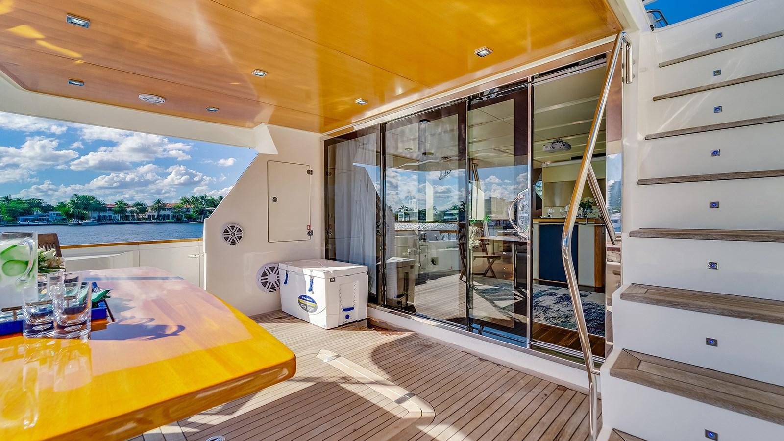 a room with a bed and a table aboard THERAPY Yacht for Sale