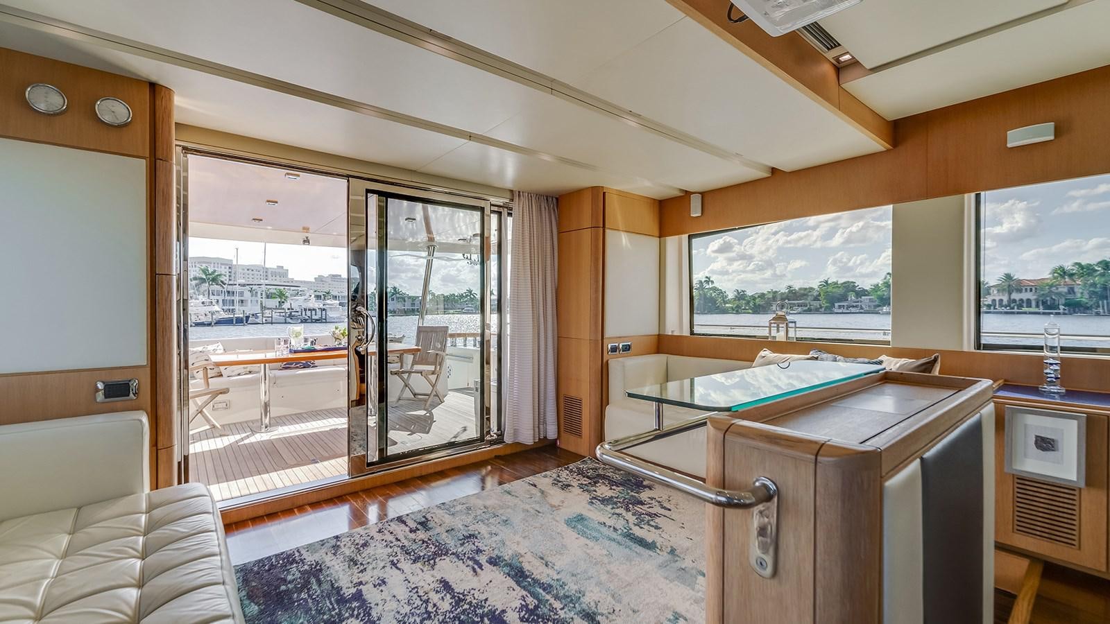 a bedroom with a large window aboard THERAPY Yacht for Sale