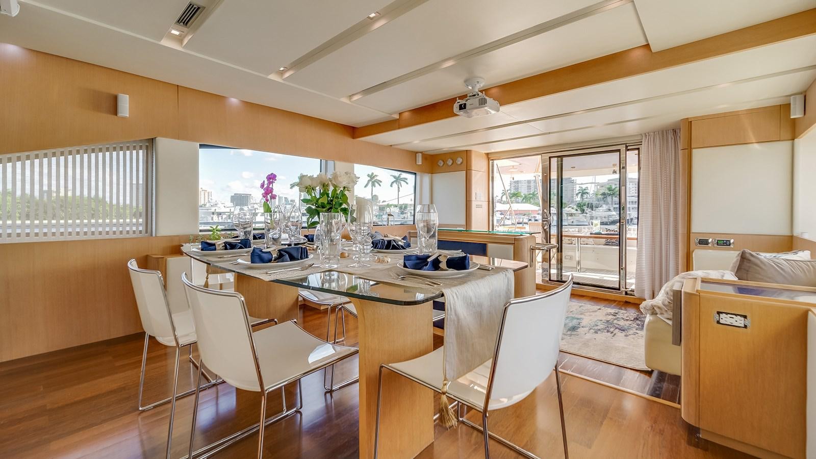 a large room with a table and chairs aboard THERAPY Yacht for Sale