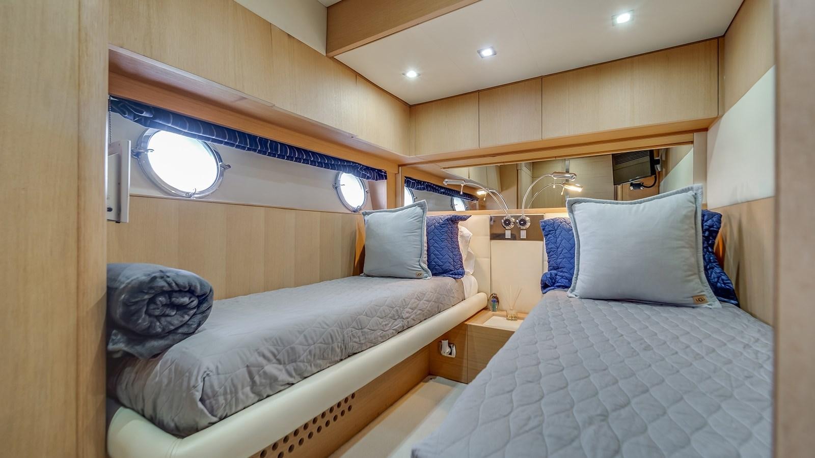 a room with two beds aboard THERAPY Yacht for Sale