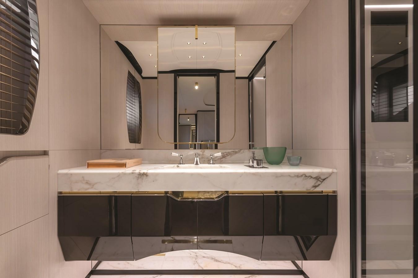 a bathroom with a large mirror aboard SEANET CO_OWNERSHIP OFFER  Yacht for Sale