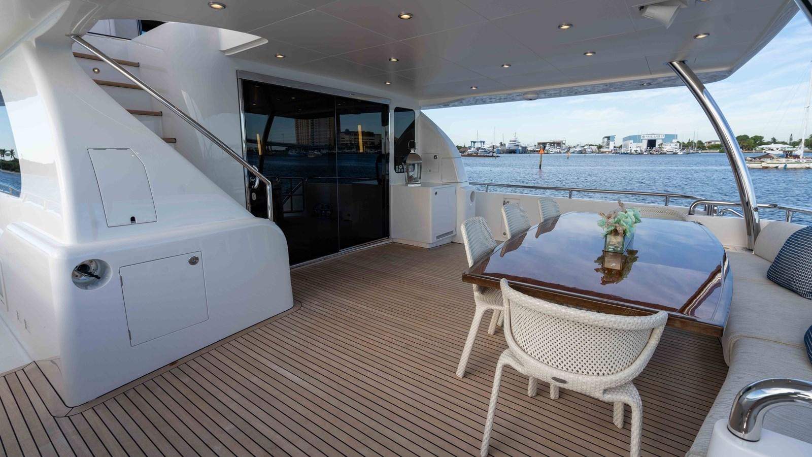 a large room with a table and chairs and a large body of water aboard SEA FAIRY Yacht for Sale