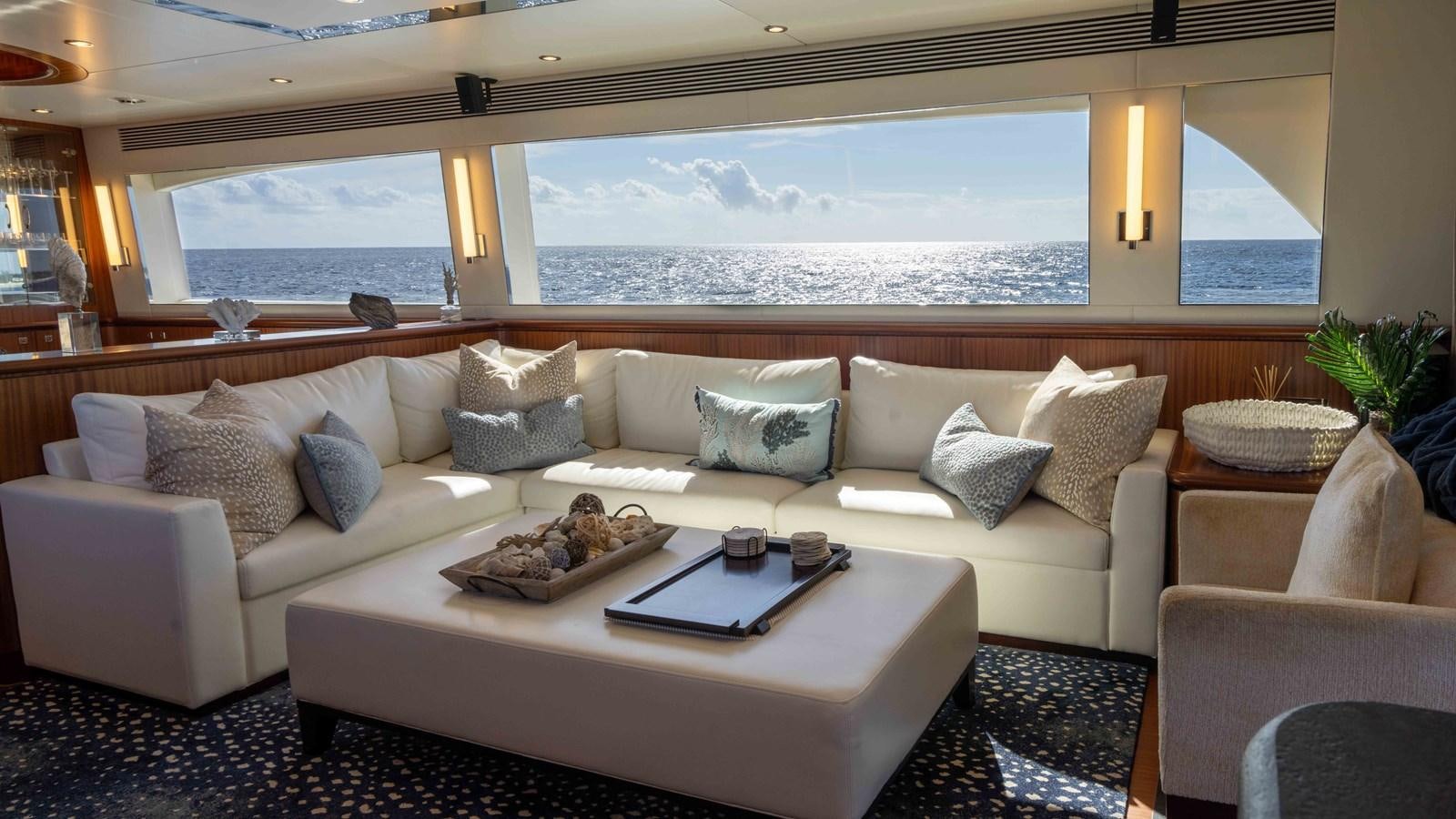 a large white couch with pillows aboard SEA FAIRY Yacht for Sale