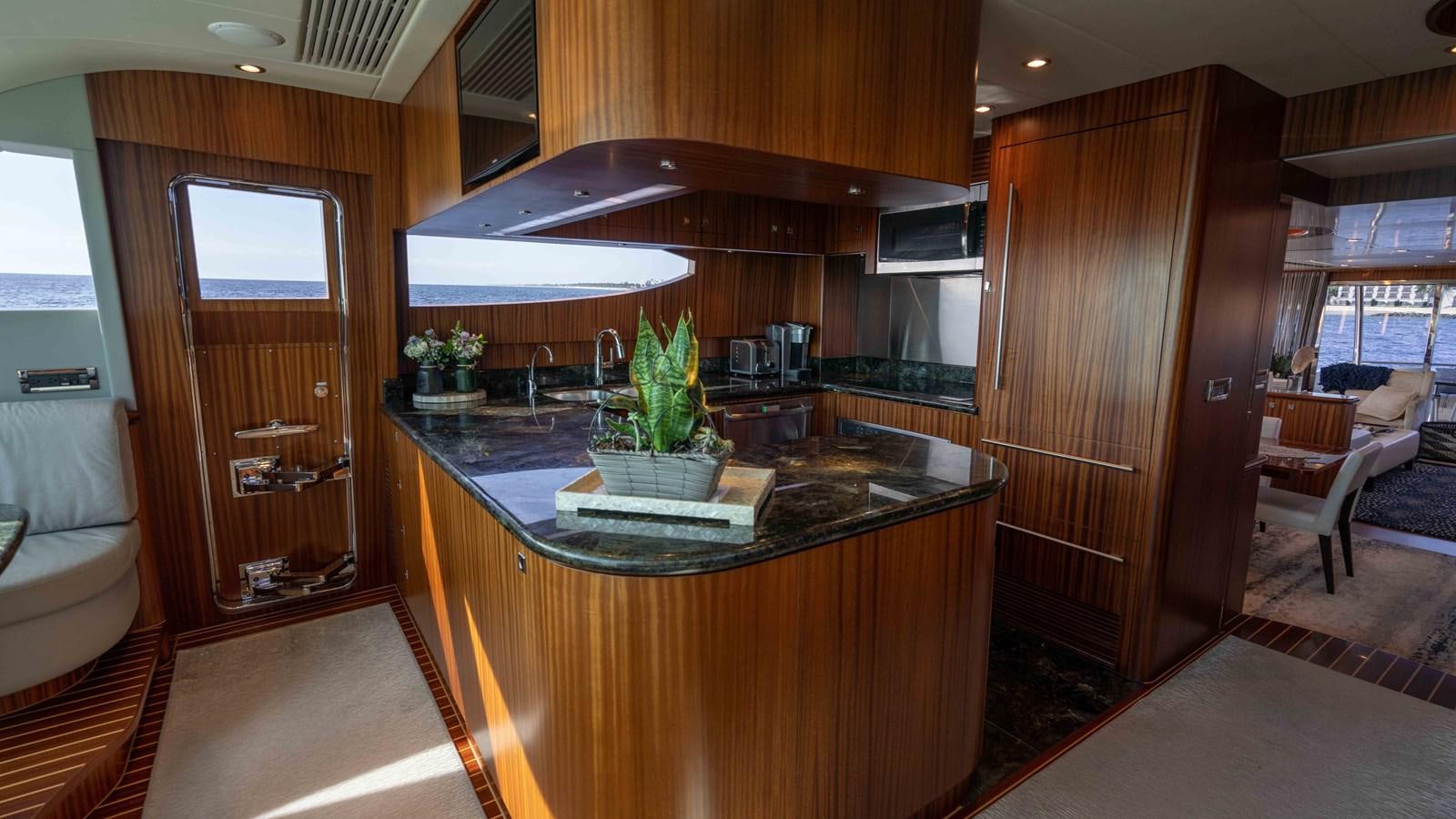 a kitchen with a large island aboard SEA FAIRY Yacht for Sale