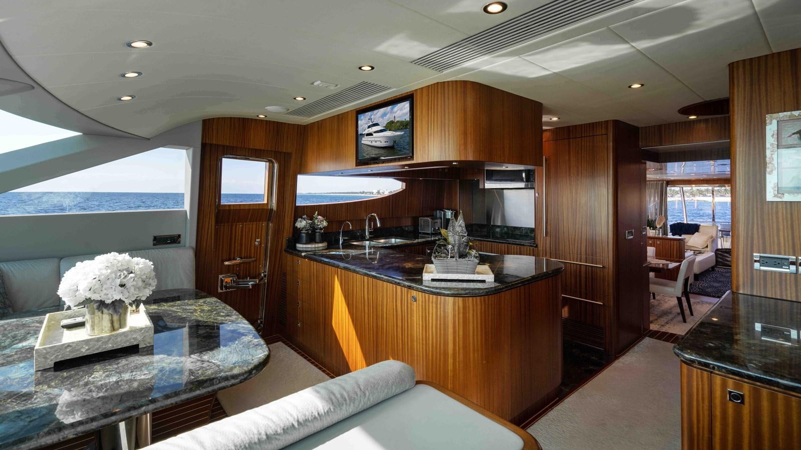 a kitchen with a large island aboard SEA FAIRY Yacht for Sale