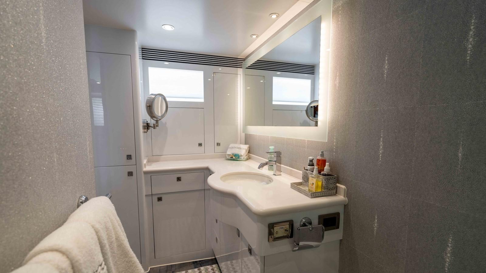a bathroom with a sink and a mirror aboard SEA FAIRY Yacht for Sale