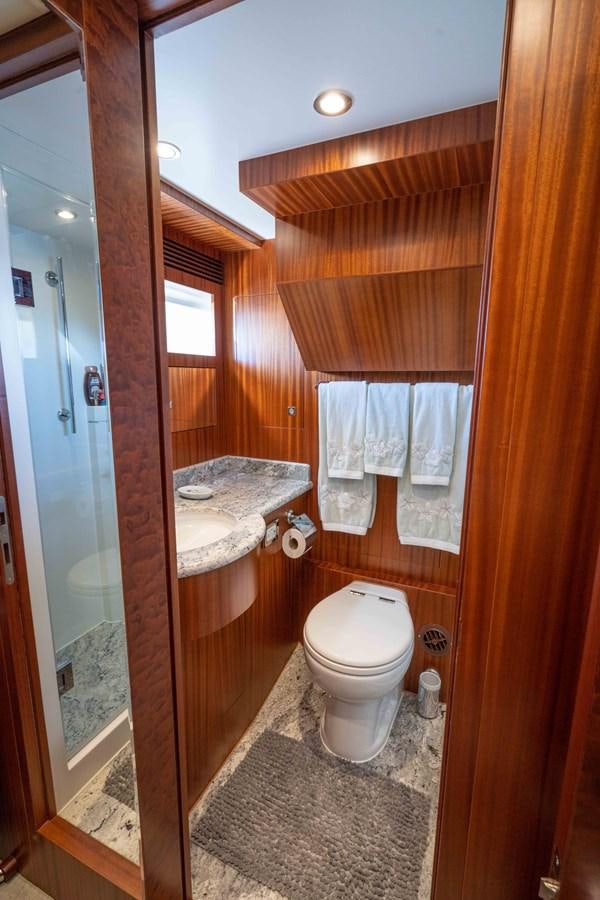 a bathroom with a toilet and a sink aboard SEA FAIRY Yacht for Sale