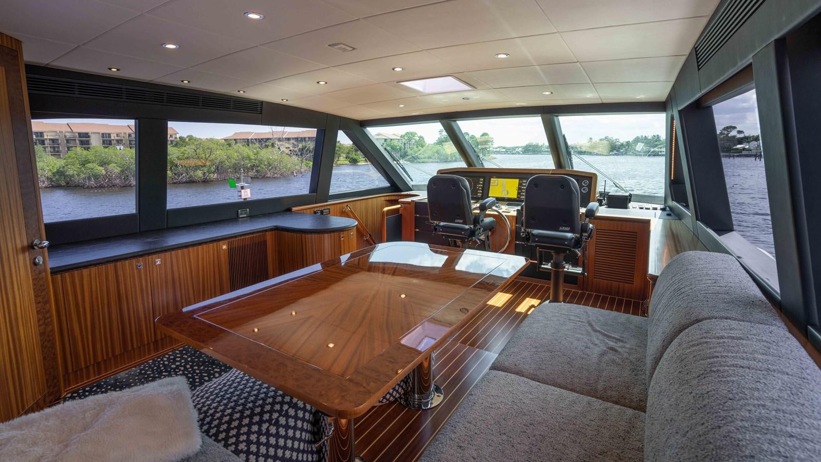 a room with a couch and a table aboard SEA FAIRY Yacht for Sale