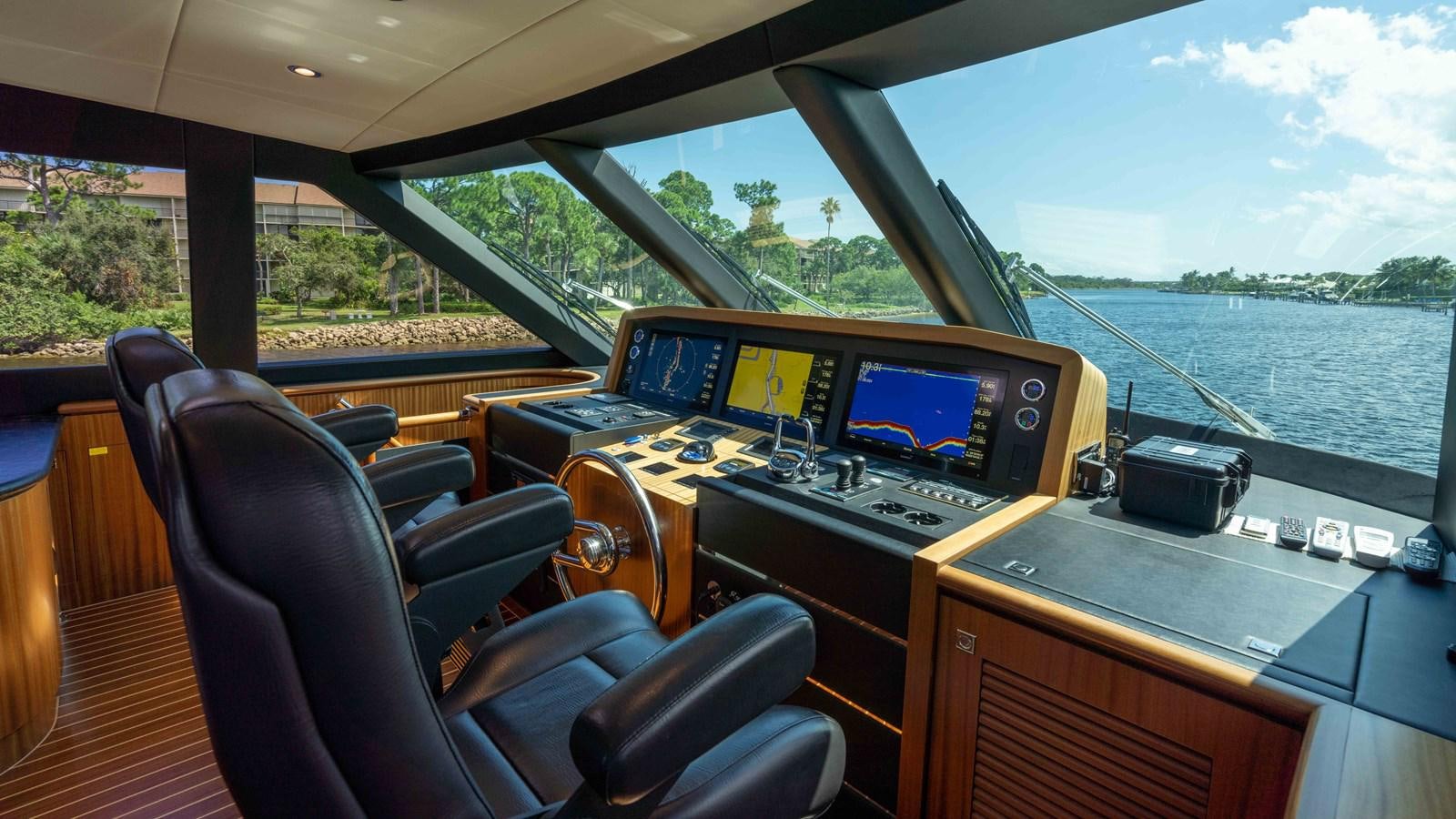 inside of a vehicle with a view of the water and trees aboard SEA FAIRY Yacht for Sale