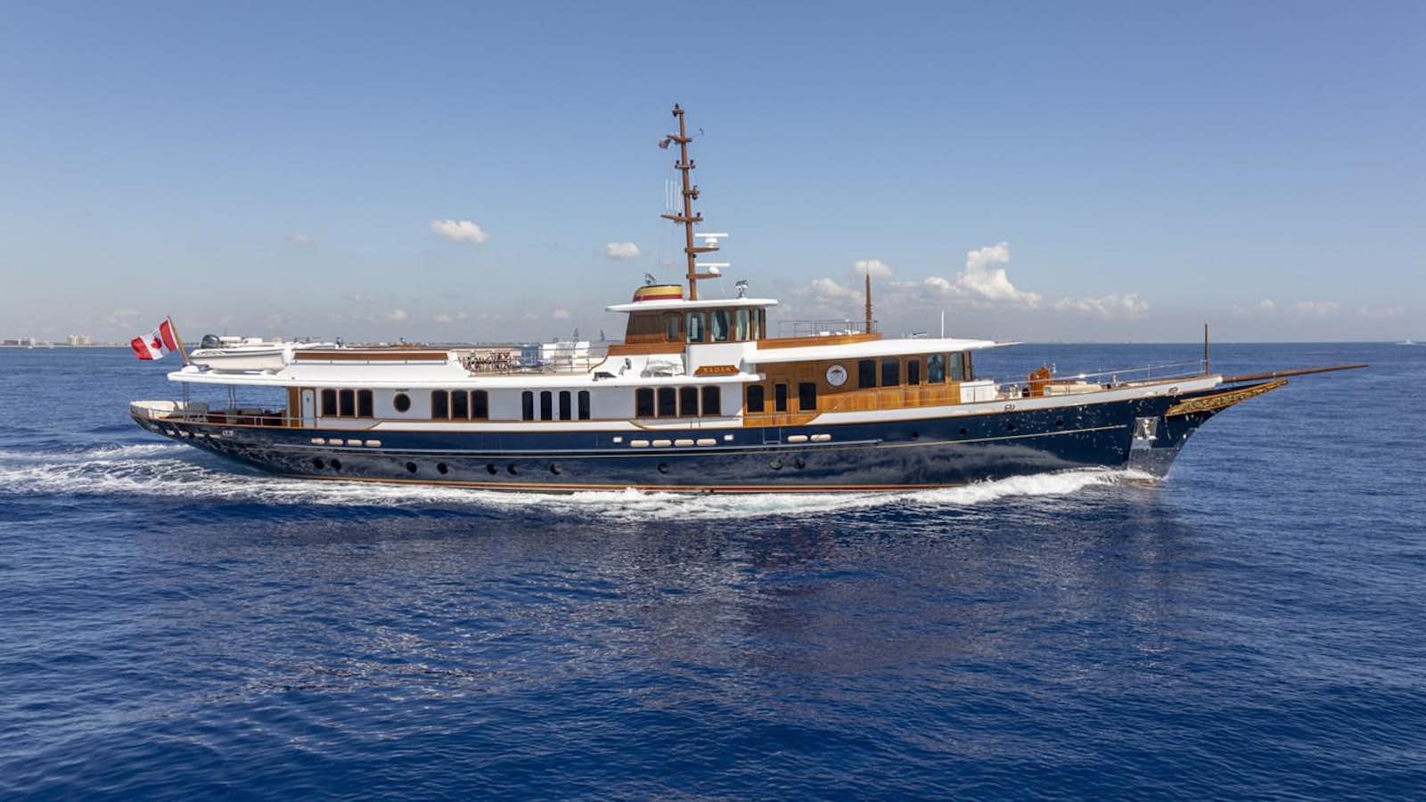 a large ship in the water aboard NADAN Yacht for Sale