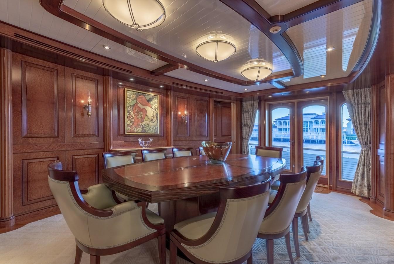 a large dining room with a large table and chairs aboard NADAN Yacht for Sale