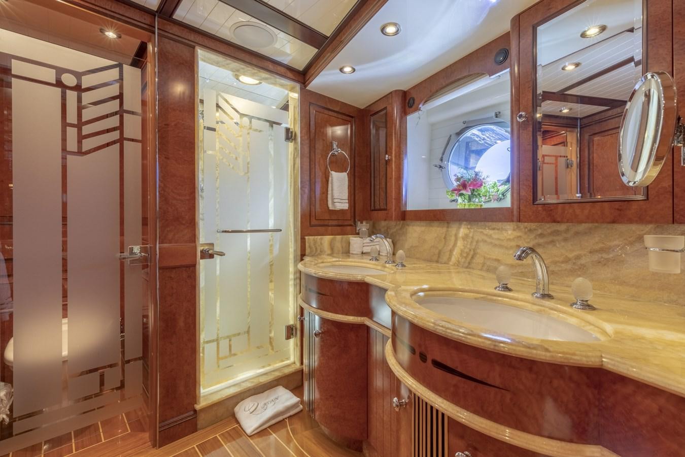 a bathroom with a sink and mirrors aboard NADAN Yacht for Sale