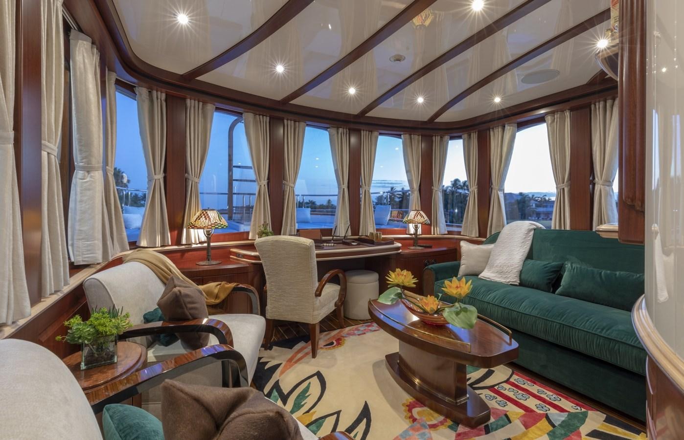 a living room with a couch and a table aboard NADAN Yacht for Sale
