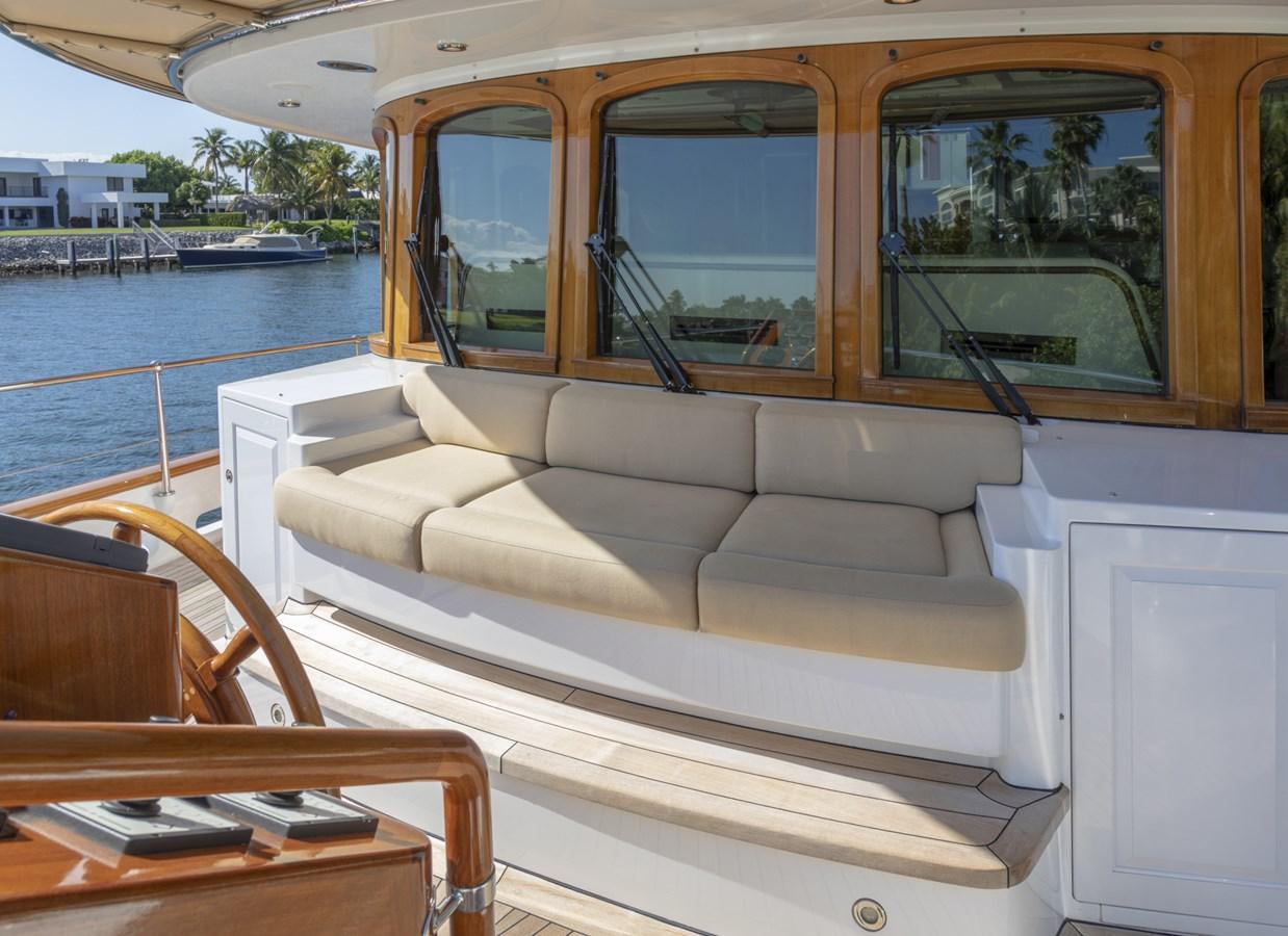 a boat with a couch and a table on it aboard NADAN Yacht for Sale