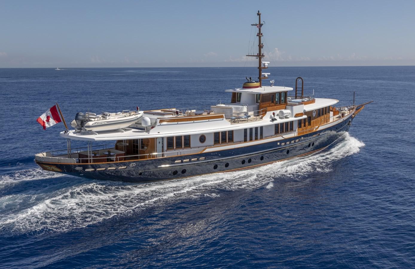 a large boat on the water aboard NADAN Yacht for Sale