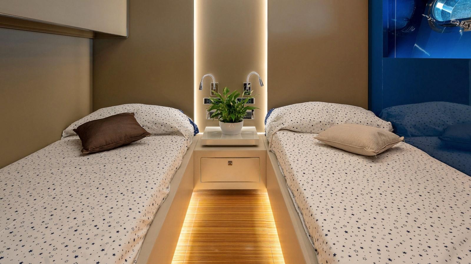 a couple of beds in a hotel room aboard MAXI DRAGO Yacht for Sale