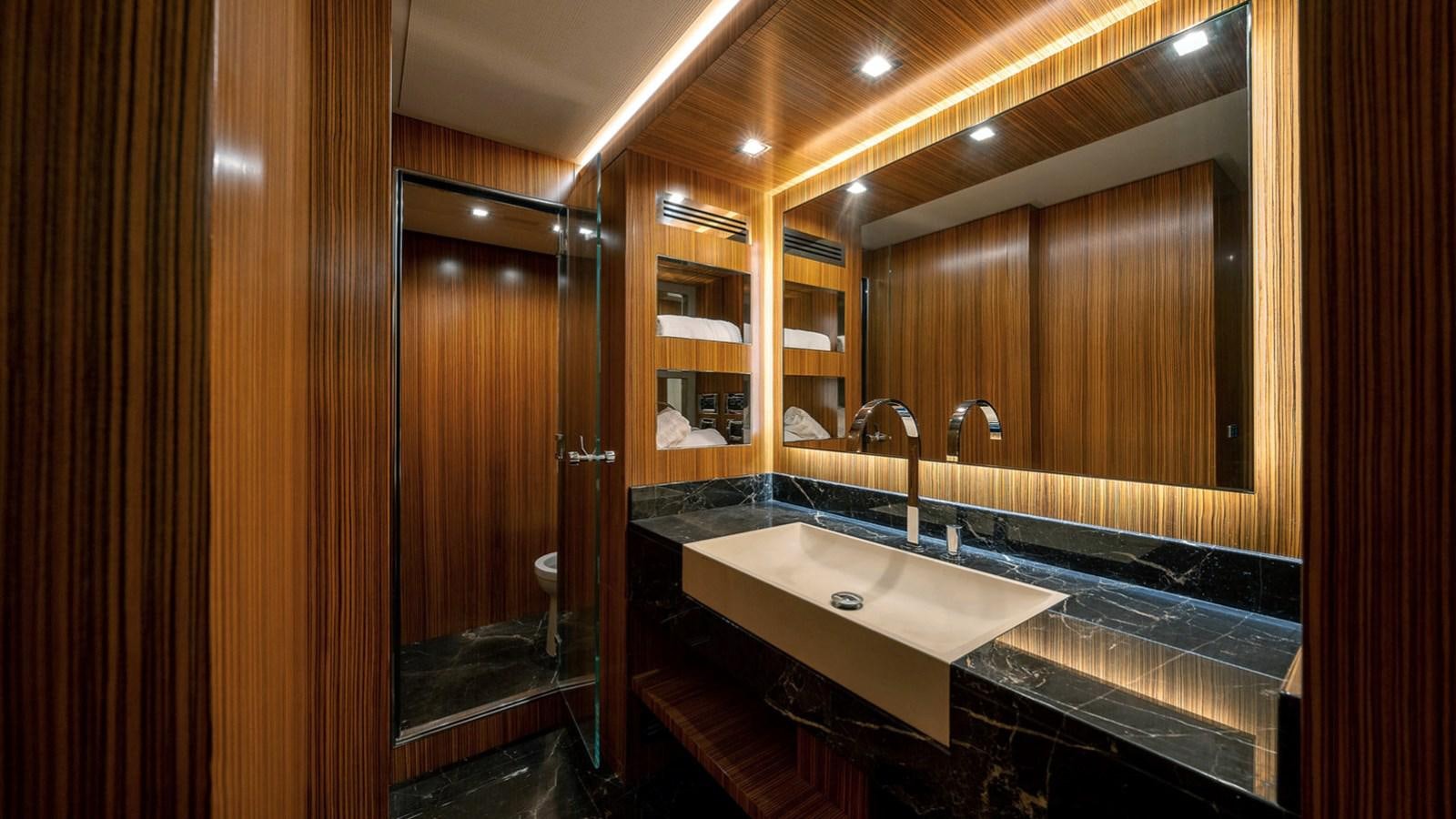 a bathroom with a sink and a mirror aboard MAXI DRAGO Yacht for Sale
