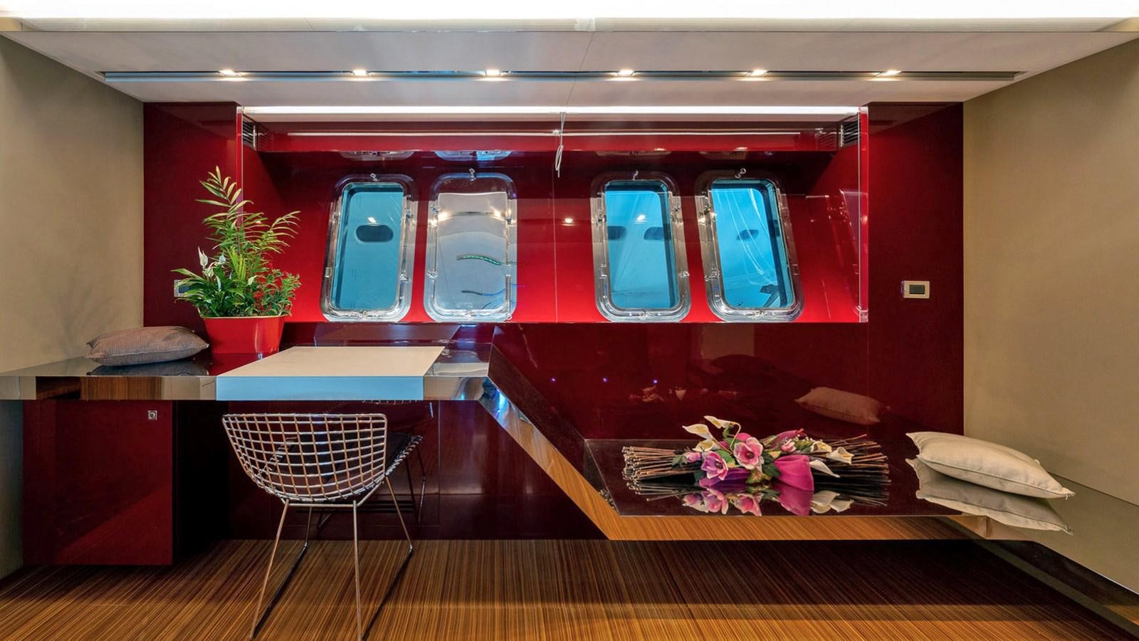 a train with a table and chairs aboard MAXI DRAGO Yacht for Sale