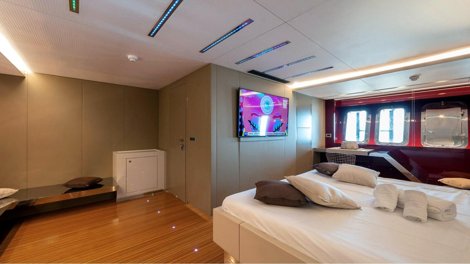 a room with a bed and a tv aboard MAXI DRAGO Yacht for Sale