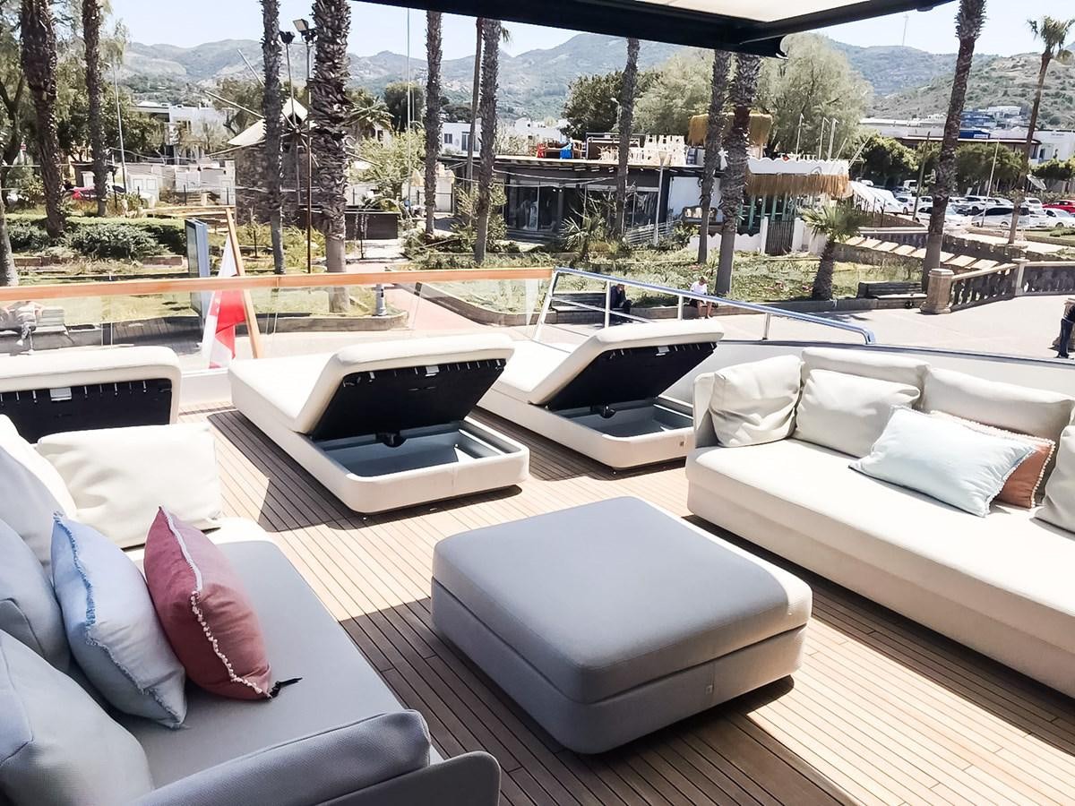a room with a couch and a pool aboard SANLORENZO SX88/01 Yacht for Sale