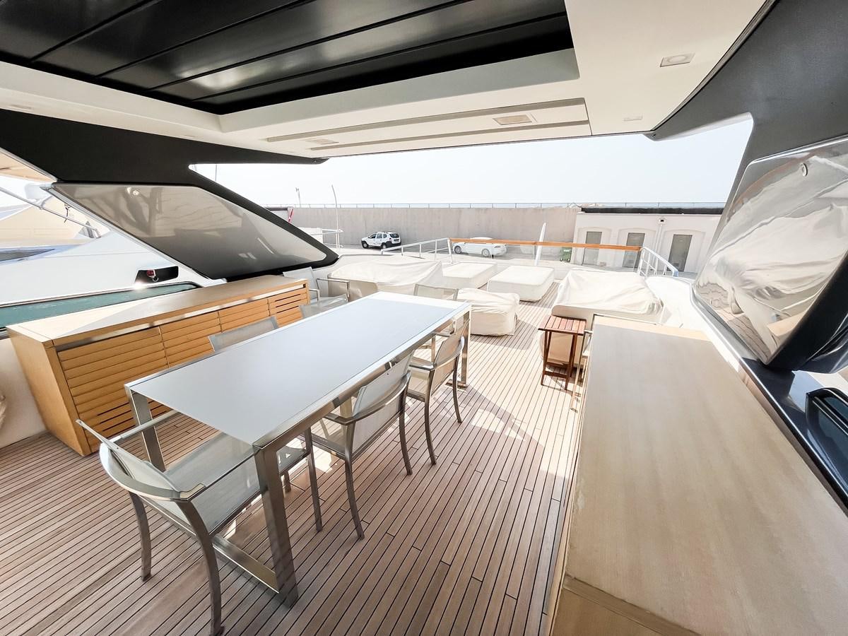 a room with a table and chairs aboard SANLORENZO SX88/01 Yacht for Sale