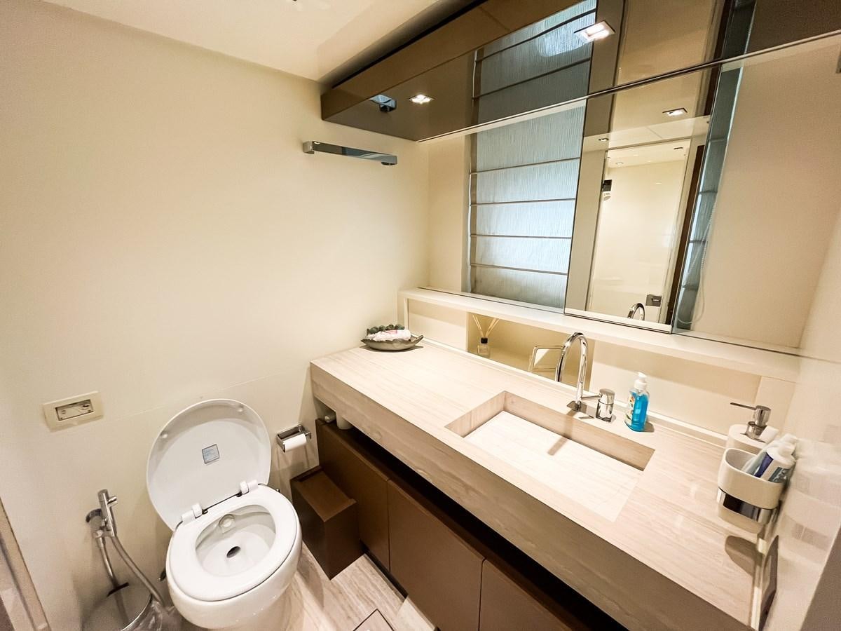 a bathroom with a large mirror aboard SANLORENZO SX88/01 Yacht for Sale