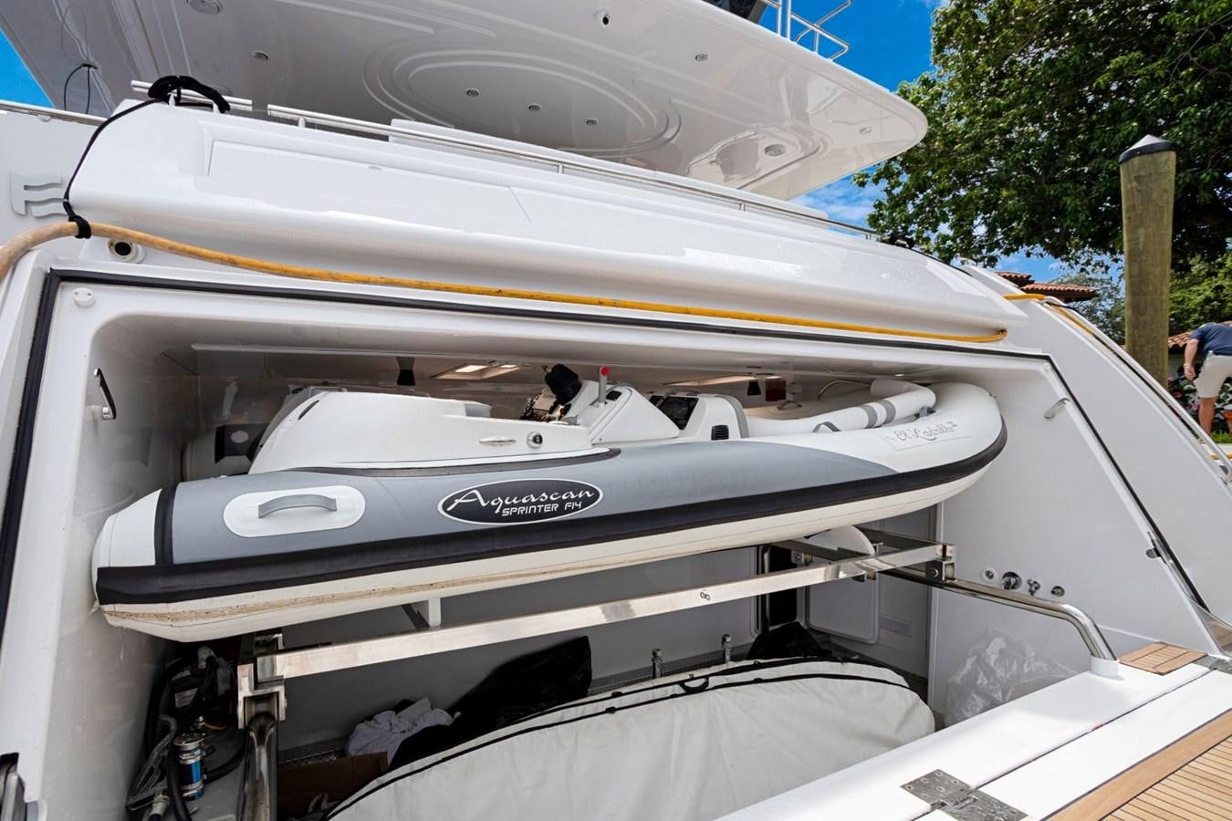 a white car with a white hood aboard SINPATICO Yacht for Sale