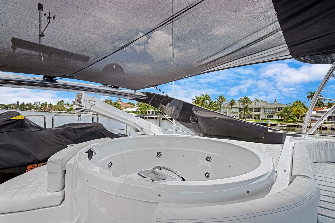 a white boat in a body of water aboard SINPATICO Yacht for Sale