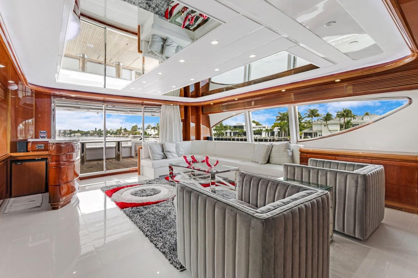 a living room with a large window aboard SINPATICO Yacht for Sale