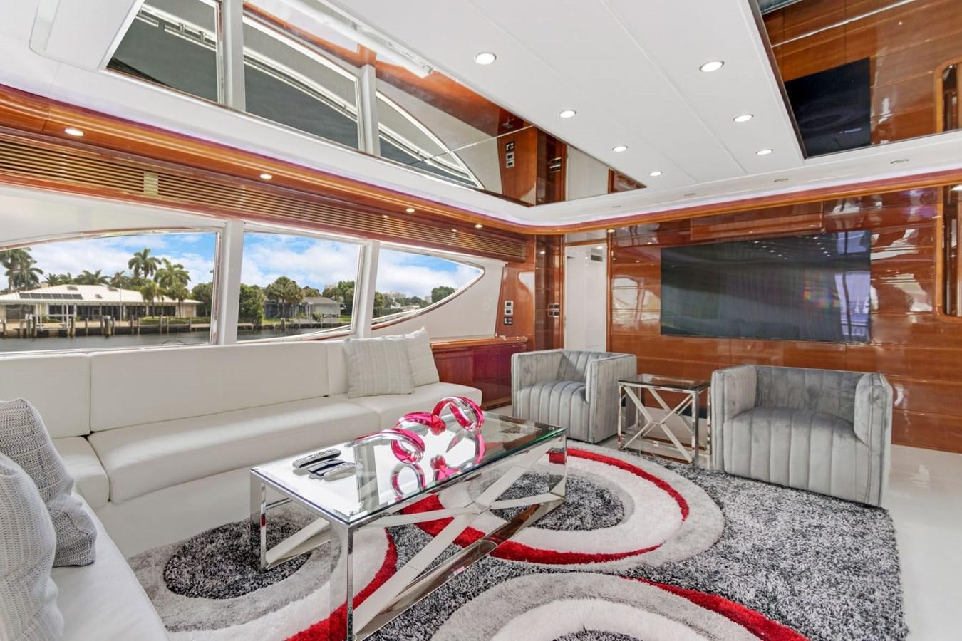 a living room with a large window aboard SINPATICO Yacht for Sale