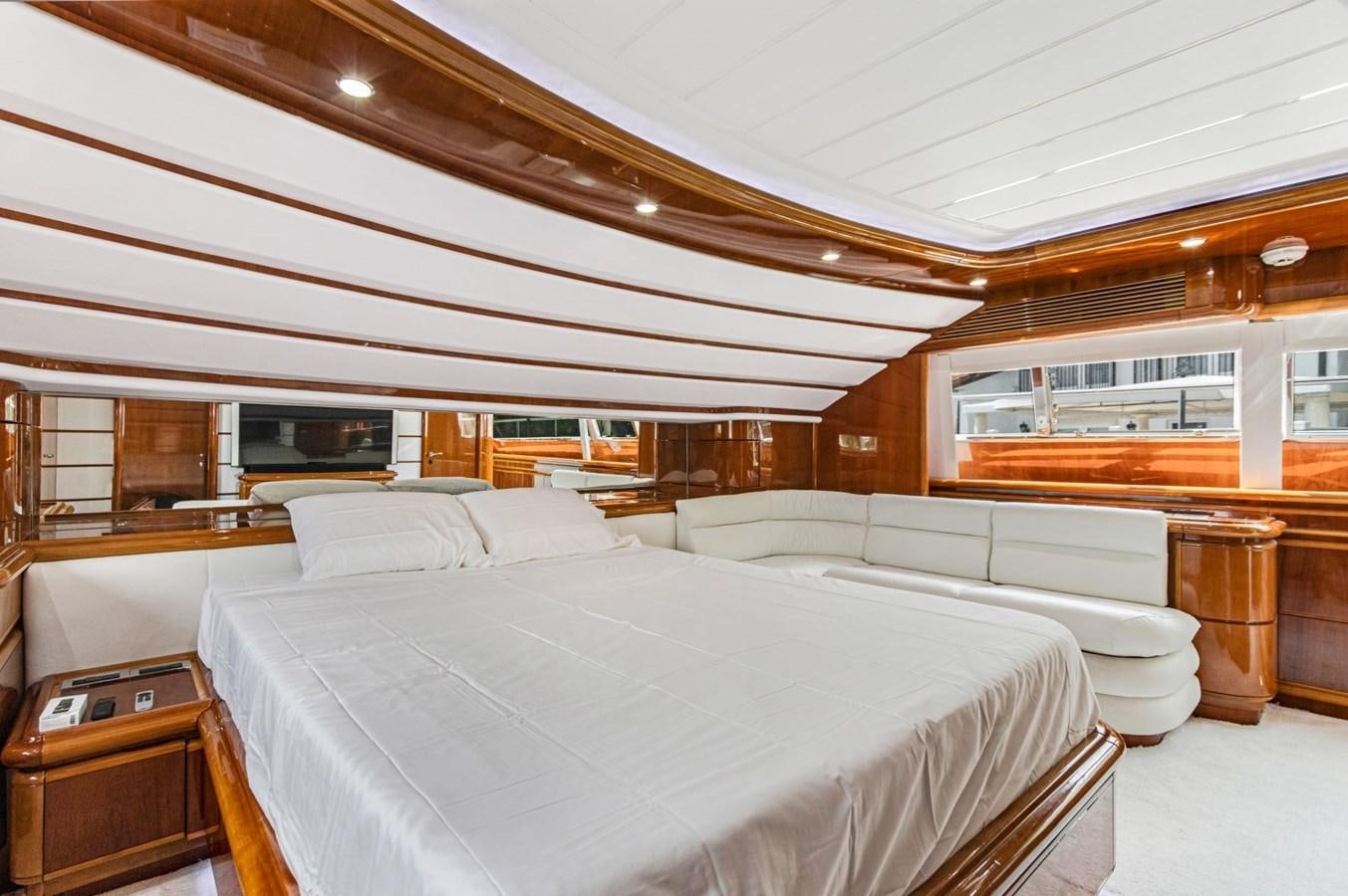 a room with a bed and a desk aboard SINPATICO Yacht for Sale