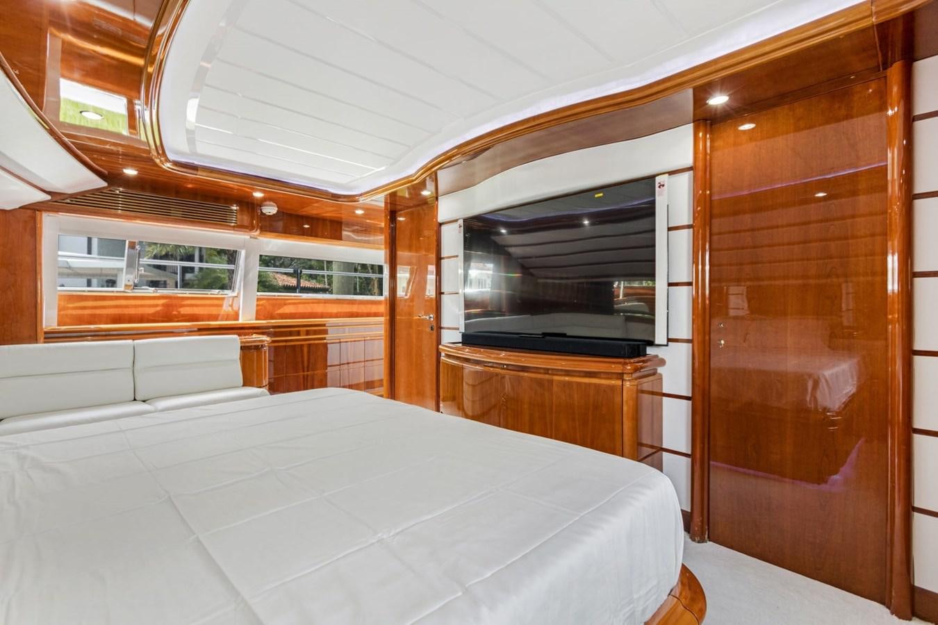 a room with a bed and a closet aboard SINPATICO Yacht for Sale