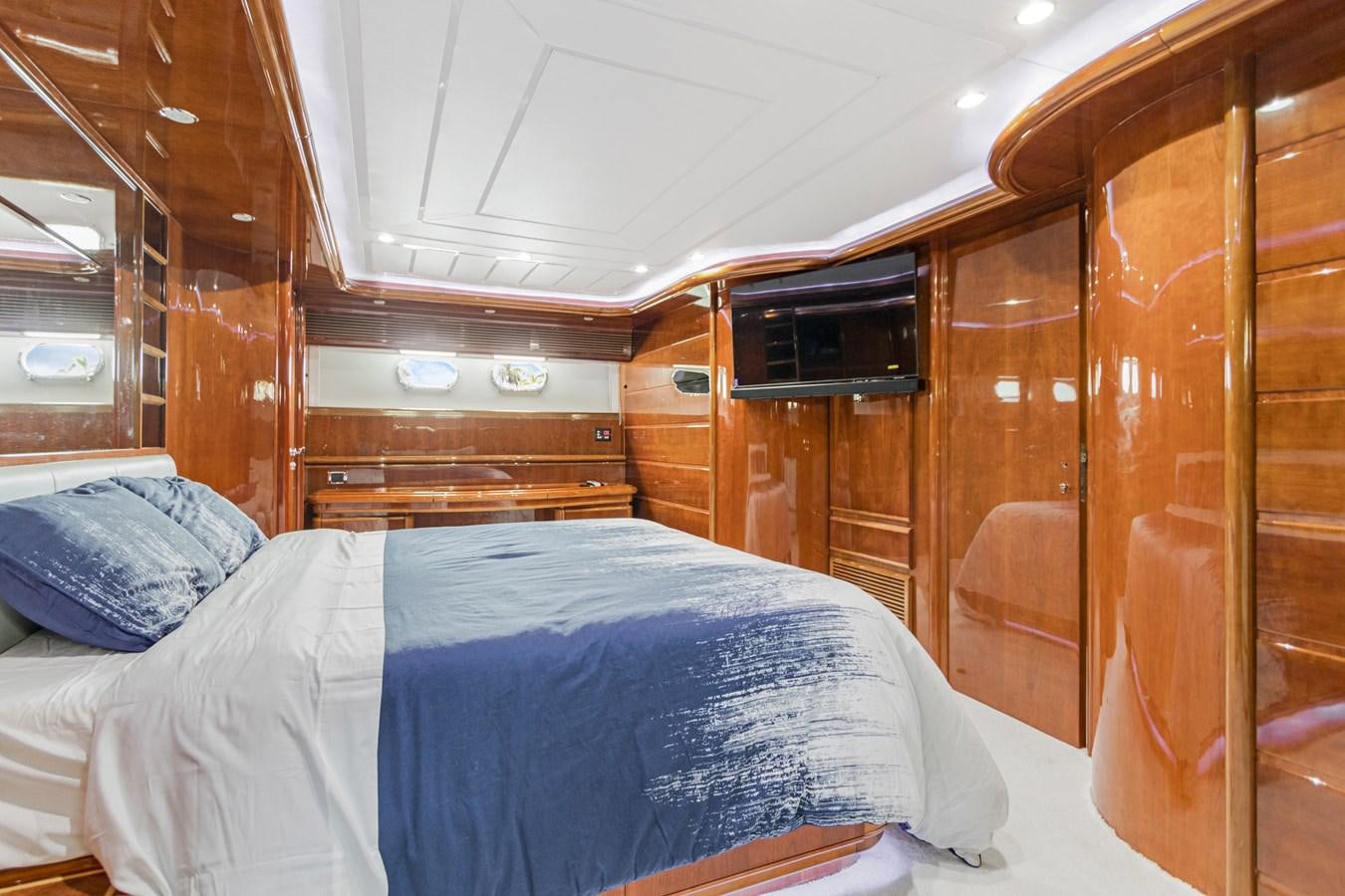 a cabin with a bed aboard SINPATICO Yacht for Sale