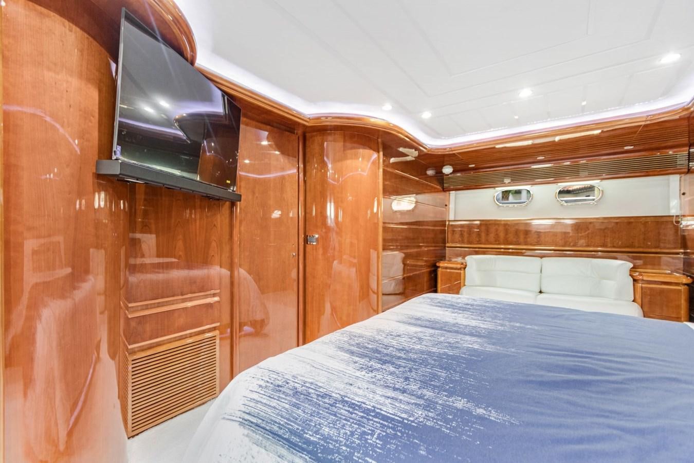 a bed with a blue sheet aboard SINPATICO Yacht for Sale