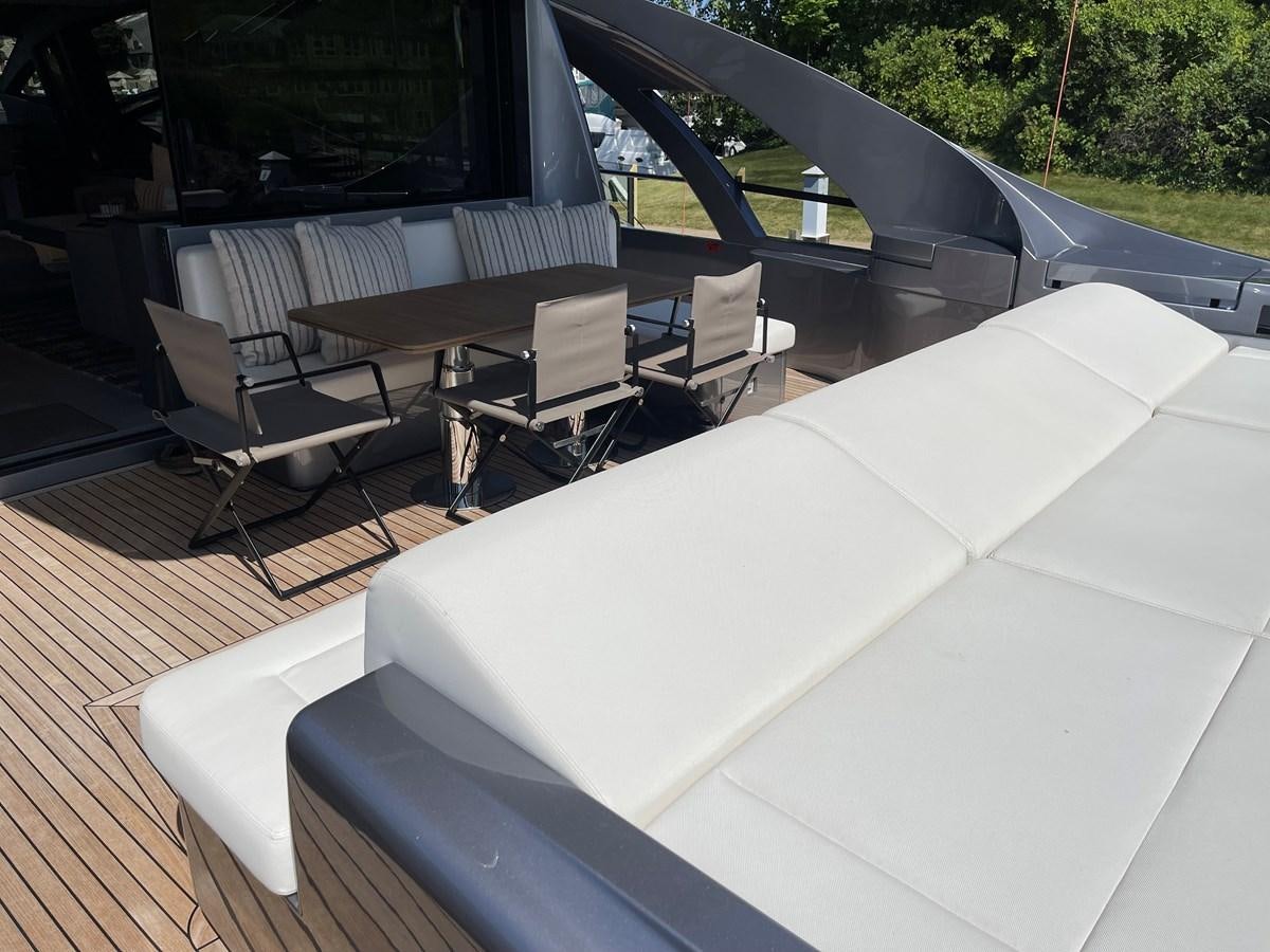 a large white table with chairs around it aboard NICKY D Yacht for Sale