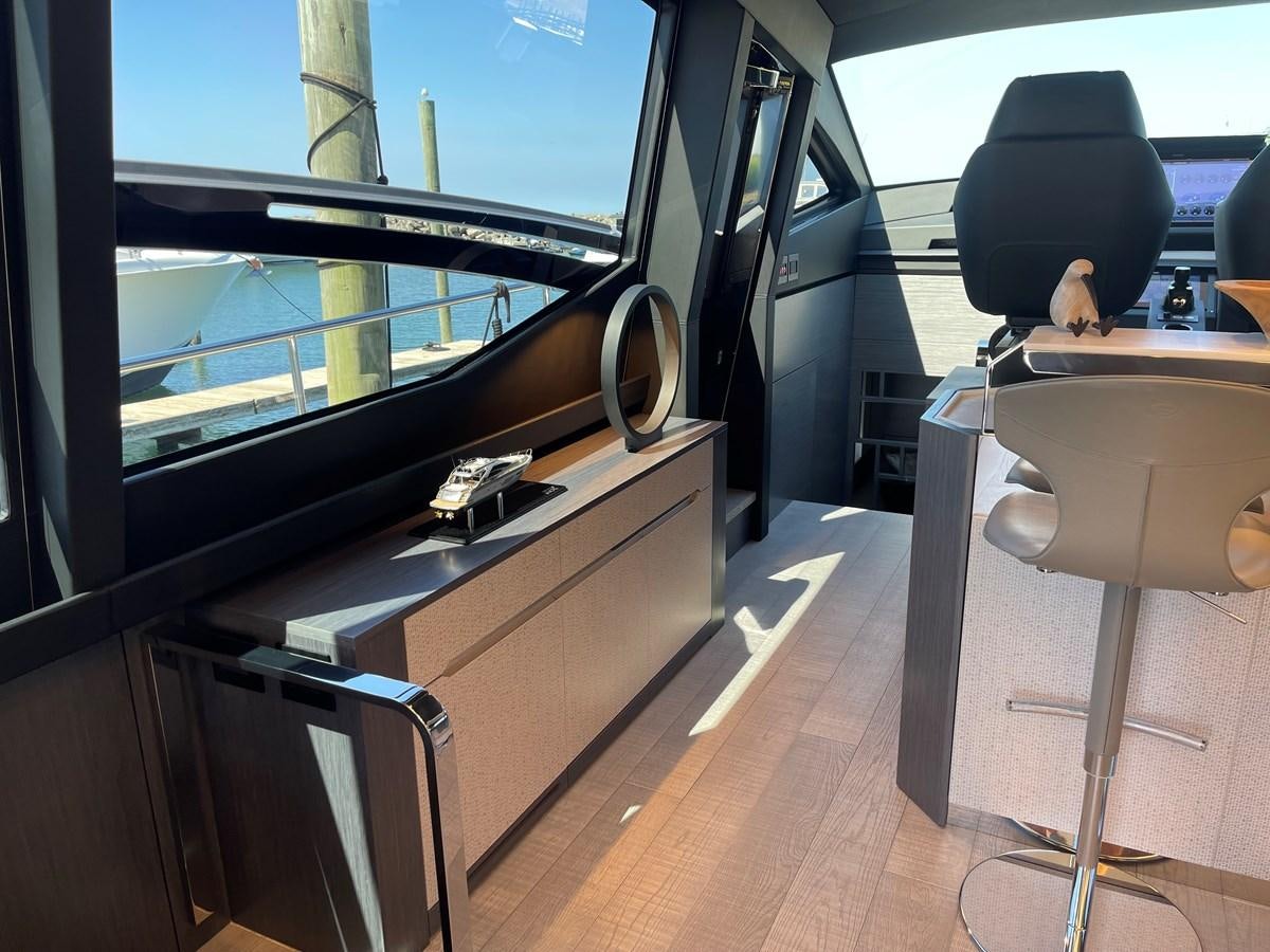 a room with a table and chairs aboard NICKY D Yacht for Sale