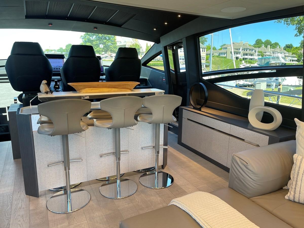 a room with a table and chairs aboard NICKY D Yacht for Sale
