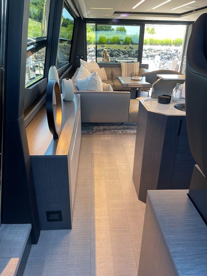 a room with a couch and a table aboard NICKY D Yacht for Sale