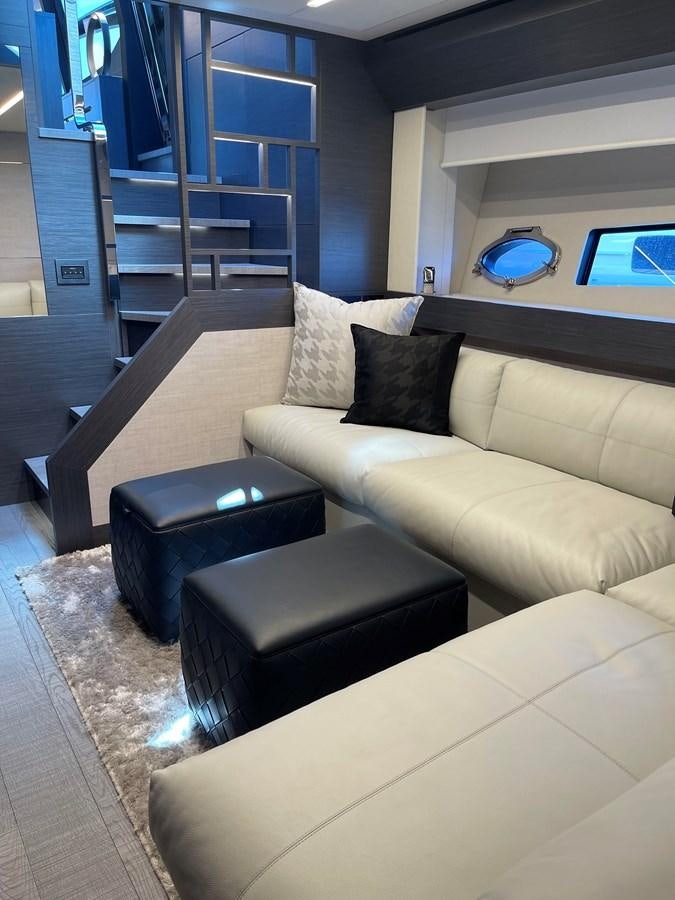 a living room with a couch and a table aboard NICKY D Yacht for Sale