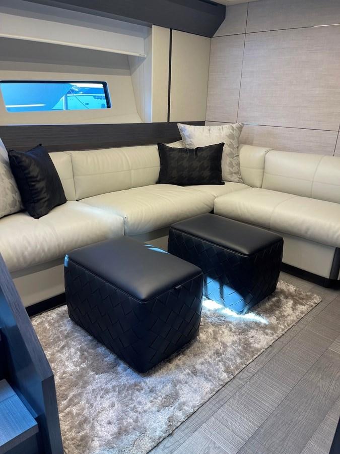a beige couch in a room aboard NICKY D Yacht for Sale
