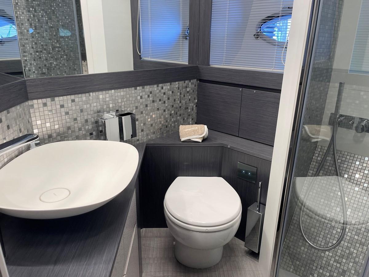 a bathroom with a sink and toilet aboard NICKY D Yacht for Sale