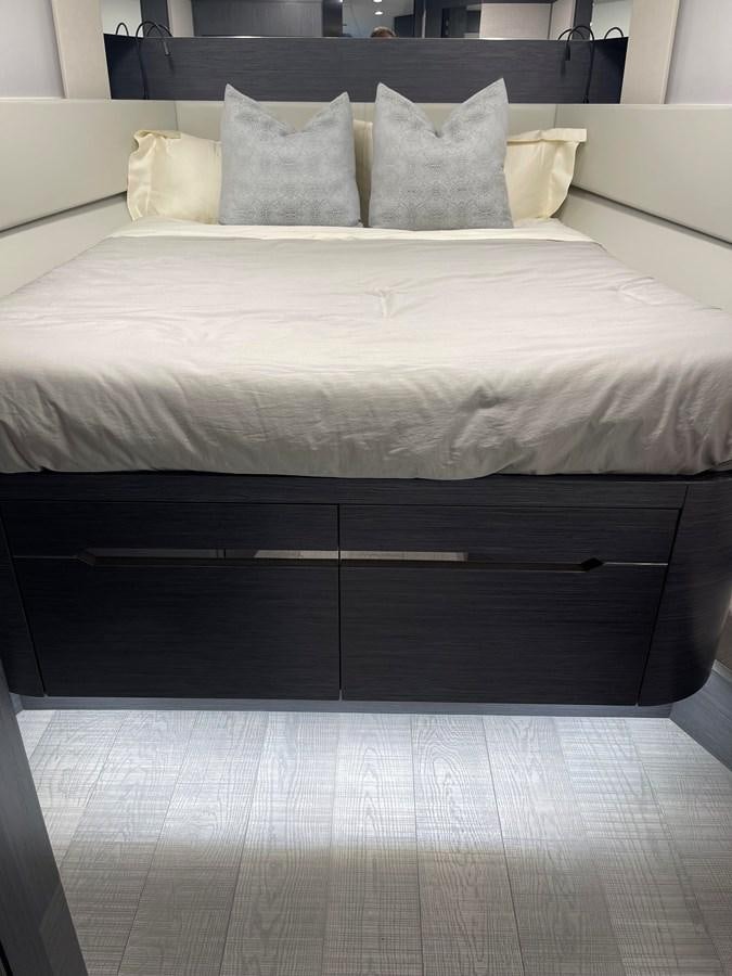 a bed with white sheets aboard NICKY D Yacht for Sale