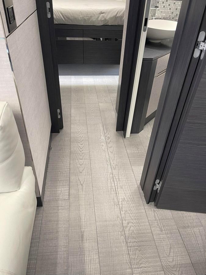 a bathroom with a black door aboard NICKY D Yacht for Sale