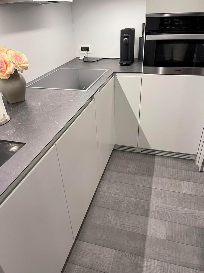 a kitchen with white cabinets aboard NICKY D Yacht for Sale