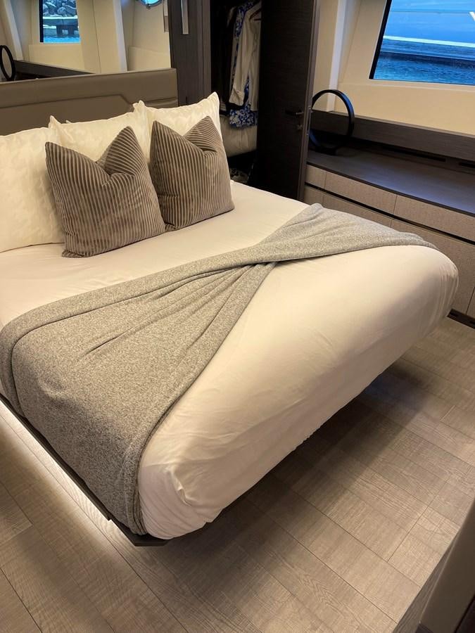 a bed with white sheets aboard NICKY D Yacht for Sale