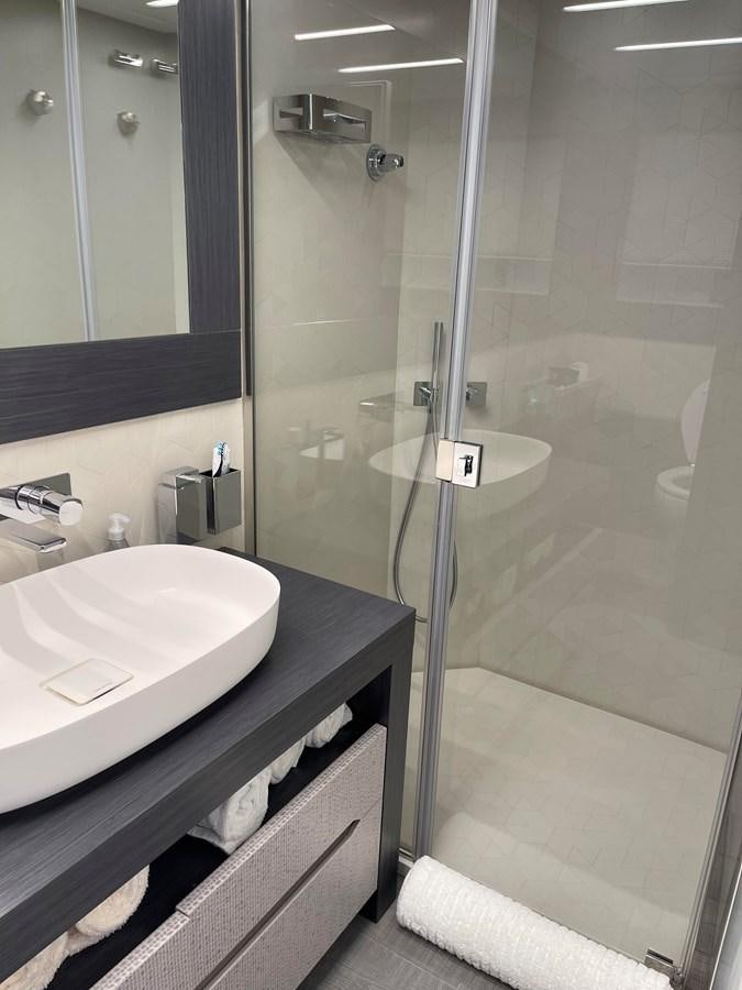 a bathroom with a sink and a shower aboard NICKY D Yacht for Sale